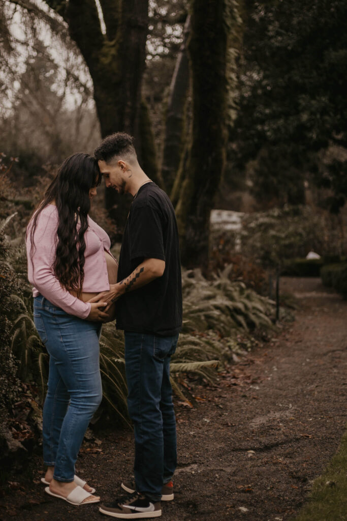 Husband and wife posing for their maternity photos.