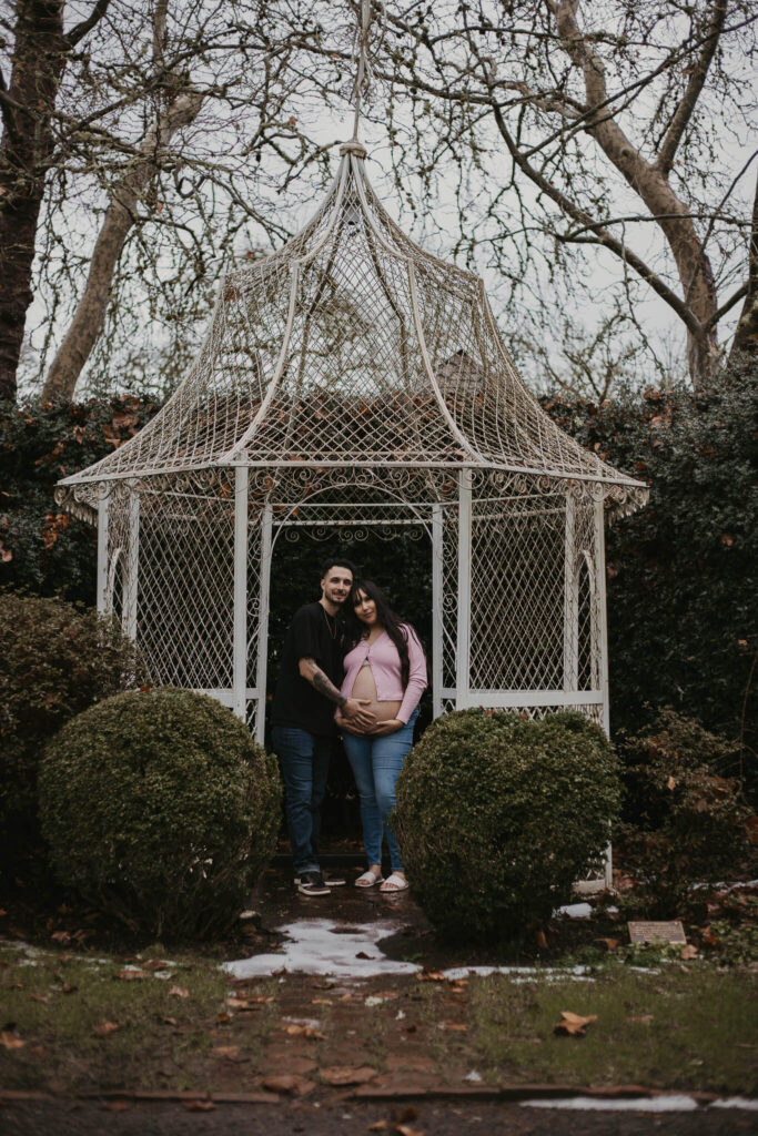 Maternity session in front of charming gazebo.